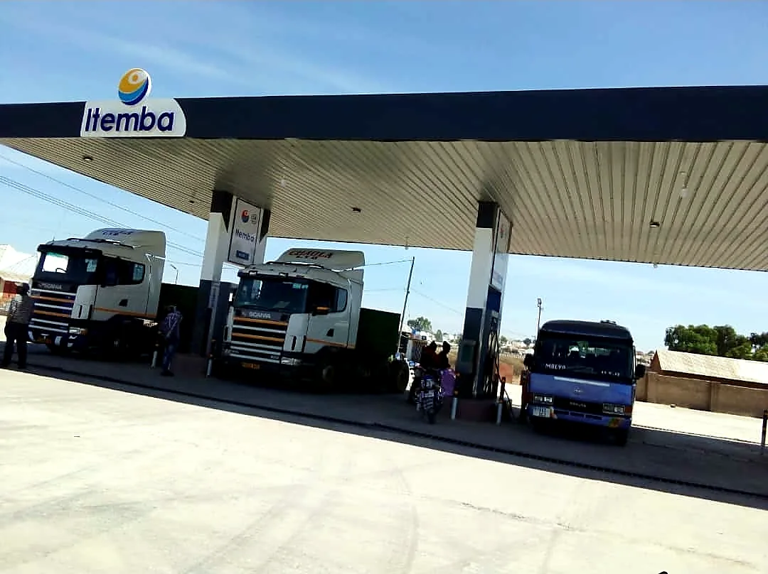 Trucks refuelling under an ITEMBA filling station canopy